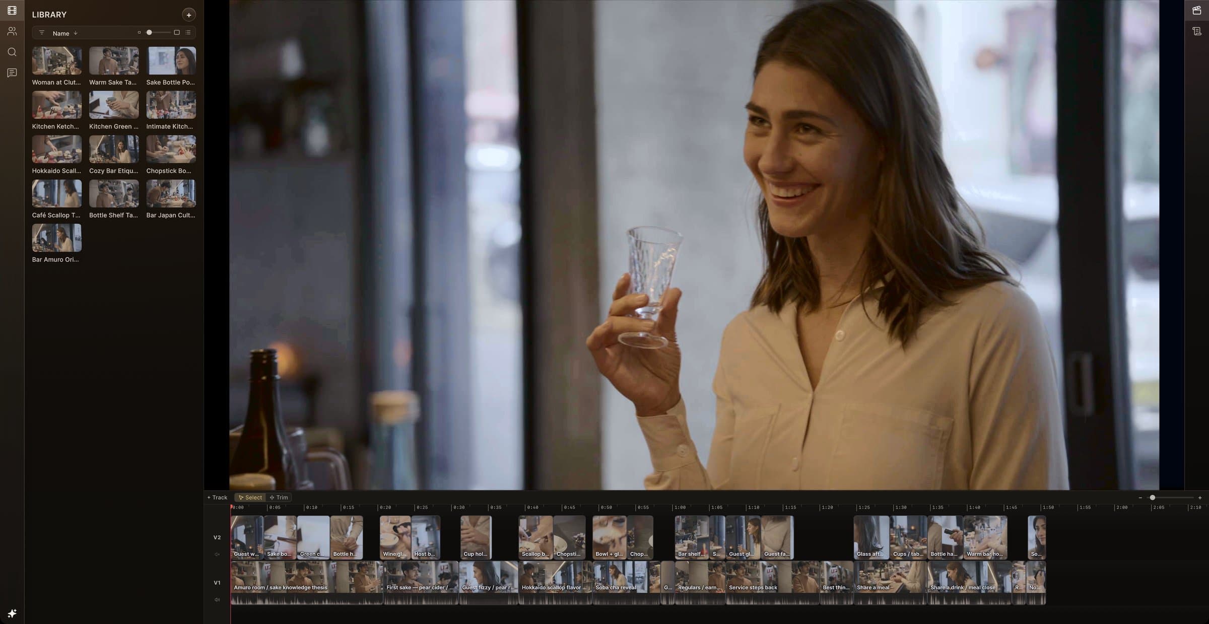 CineLogic editor playing a guest raising a sake glass and laughing, beside an analysed media library and a two-track documentary cut